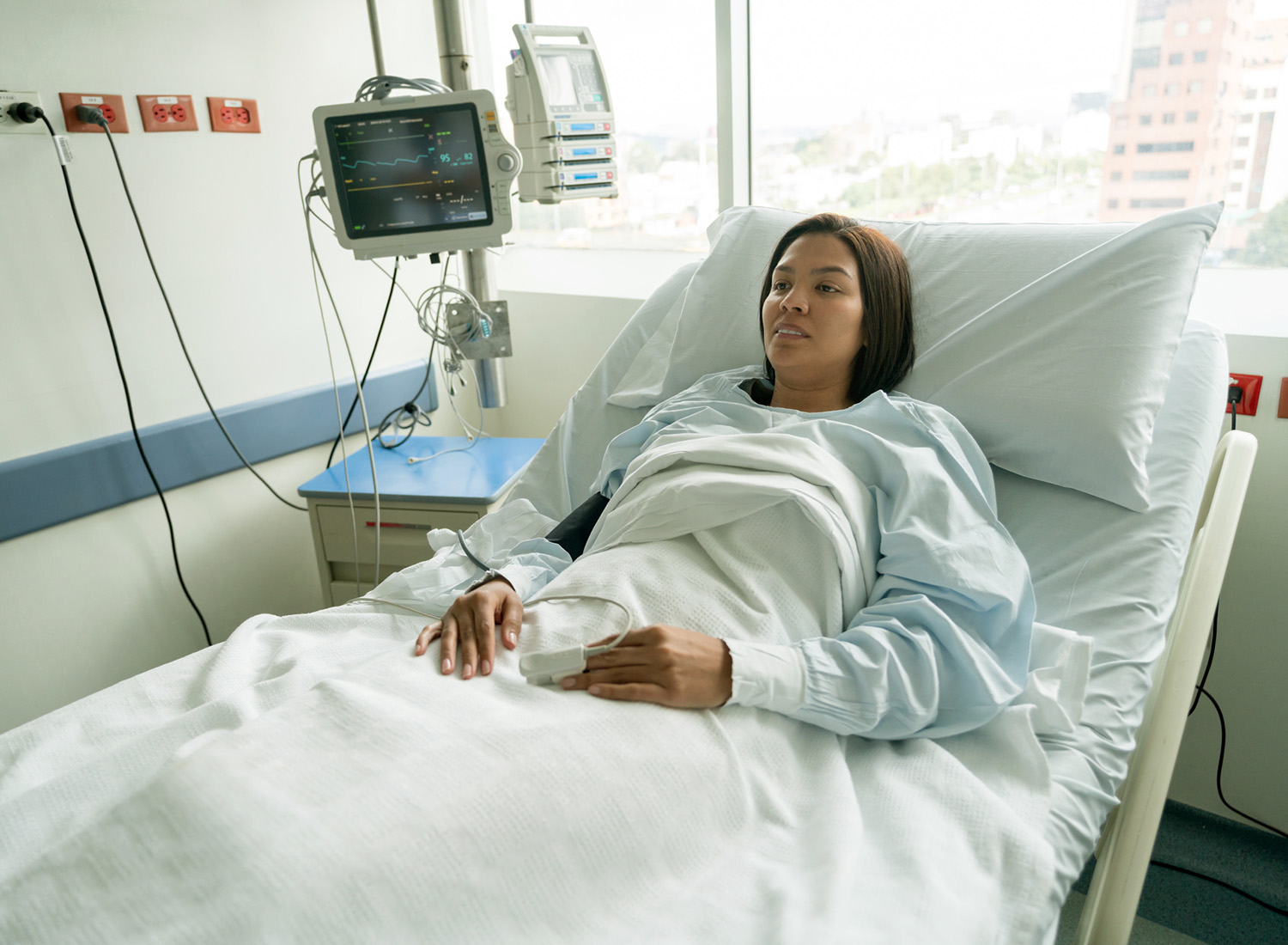 woman in hospital bed waiting for colon surgery, colon & rectal surgeons, colon and rectal surgeon, colon and rectal surgery, anus surgery, proctologist exam, colon, colon surgery