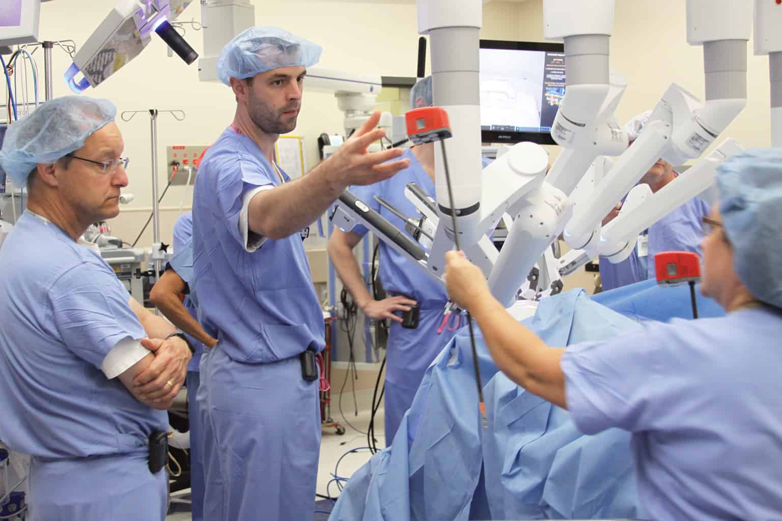 several urology surgical providers using laparoscopic surgery device in the urology clinic